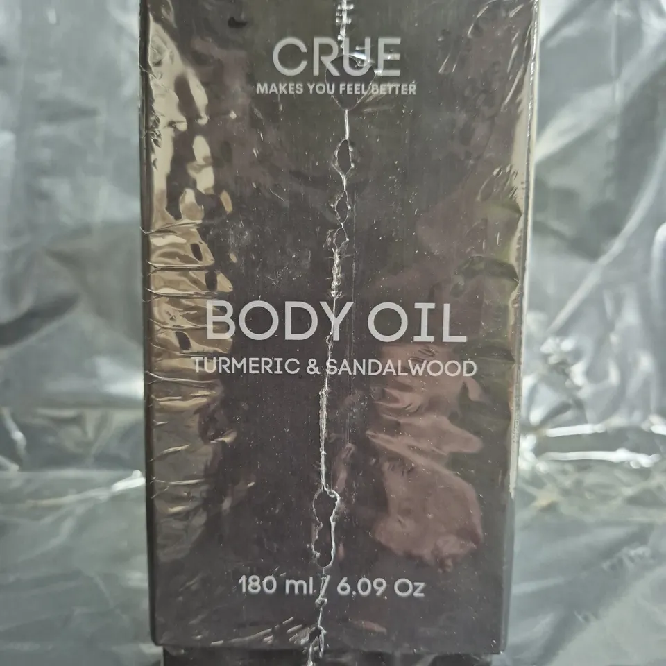 BOX OF APPROXIMATELY 16 SEALED CRUE TURMERIC & SANDALWOOD BODY OIL