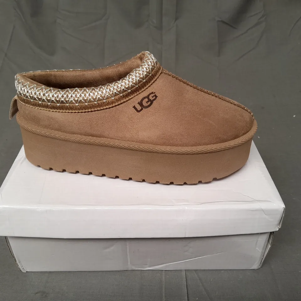BOXED PAIR OF UGG SLIP ON SHOES IN LIGHT BROWN SIZE EU 36