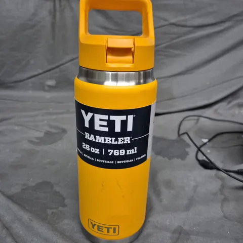 MIXED CONSUMER ITEMS INCLUDING YETI RAMBLER BOTTLE, THE BEAUTY CROP PRODUCT, NEON GREEN PEELER, AND ASSORTED TOOLS