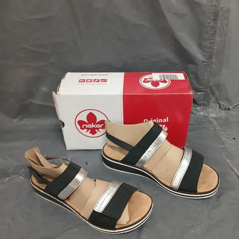 BOXED PAIR OF RIEKER TRAP SANDAL NAVY SIZE 7 1/2 