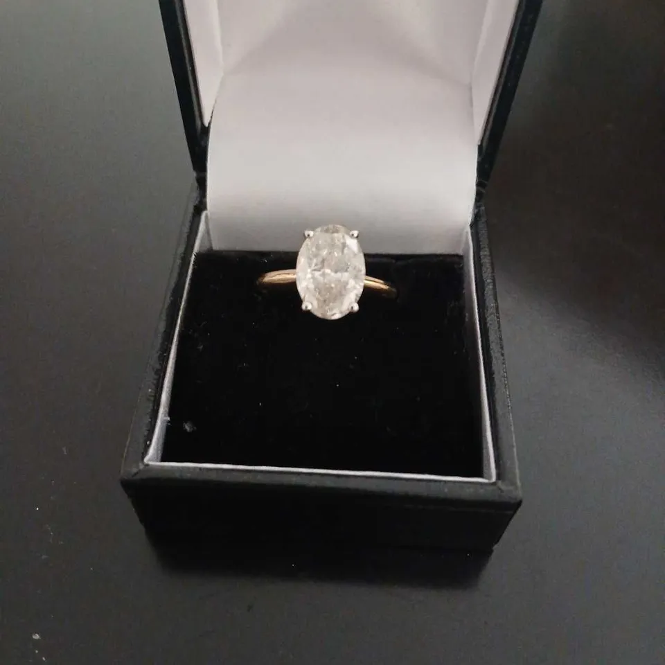 18CT GOLD SOLITAIRE RING SET WITH A NATURAL OVAL CUT DIAMOND WEIGHING +2.66CT