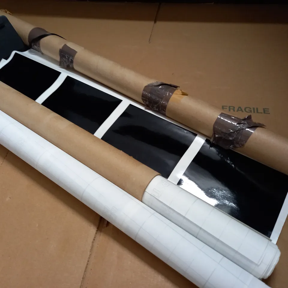 2 ROLLED TUBES OF BLACK SQUARE VINYL STICKERS - SIZE UNSPECIFIED