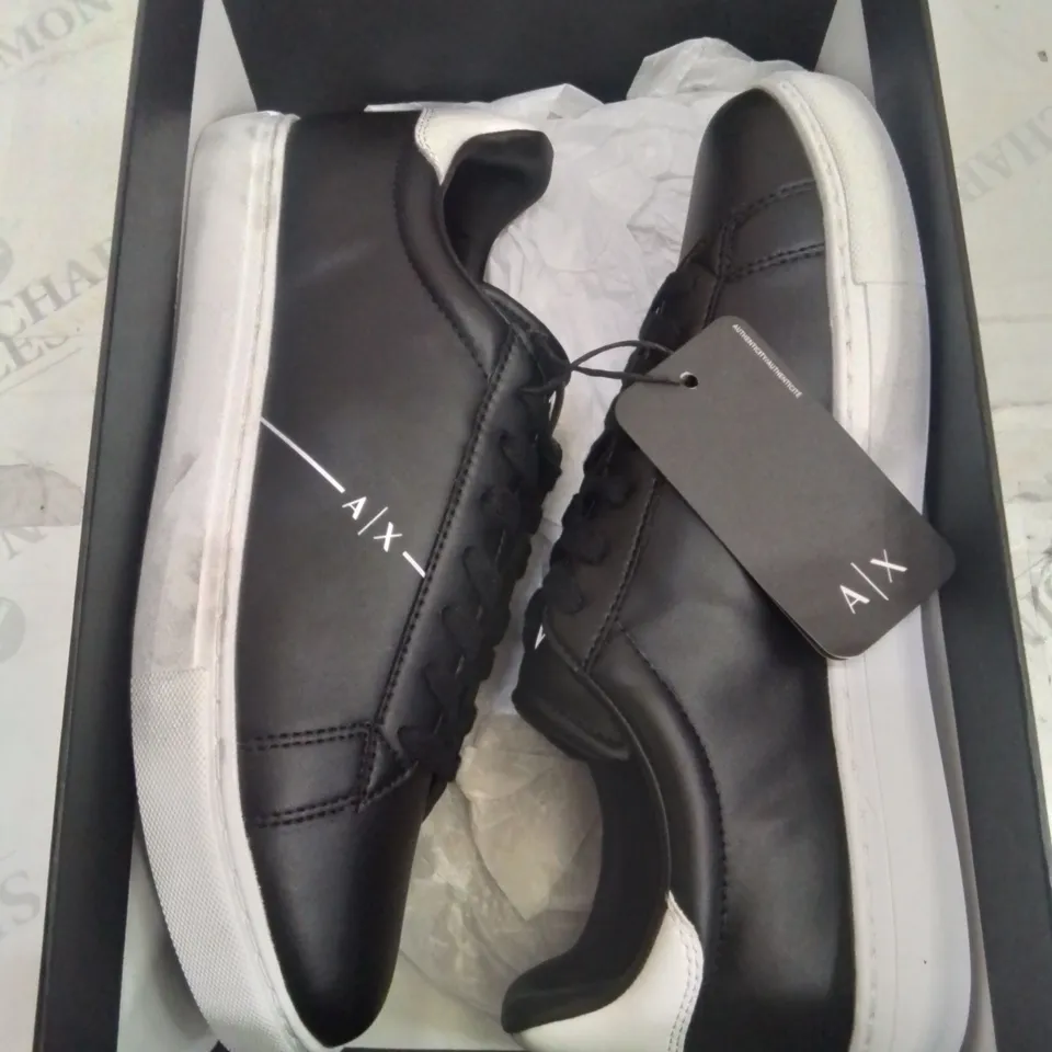 BOXED PAIR OF ARMANI EXCHANGE SIZE NINE BLACK TRAINERS.