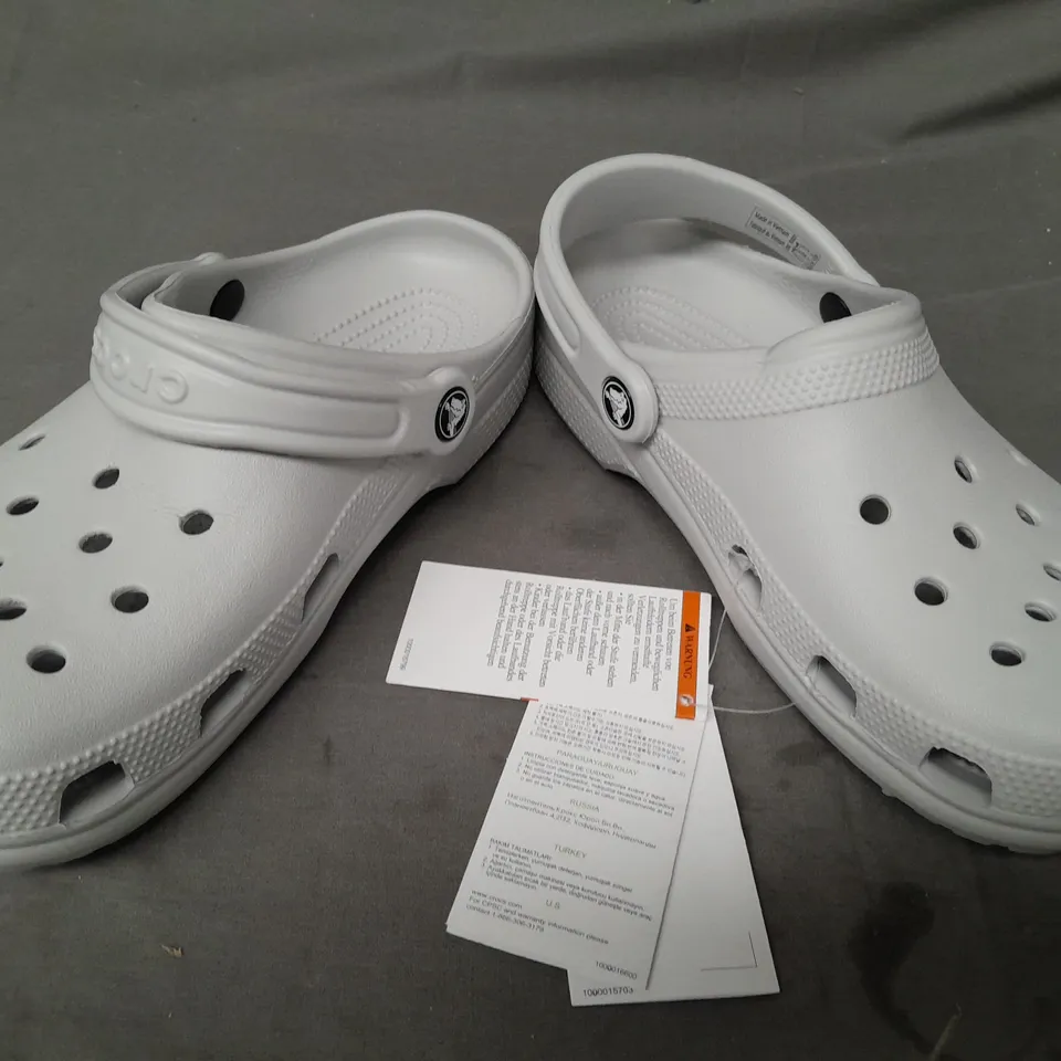 PAIR OF CROCS CLASSICS IN GREY UK SIZE M5/W6
