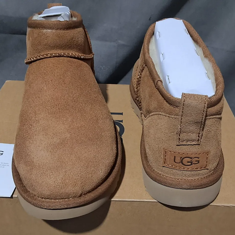 BOXED PAIR OF UGG CLASSIC ULTRA MINI BOOTS IN BROWN - UK 7