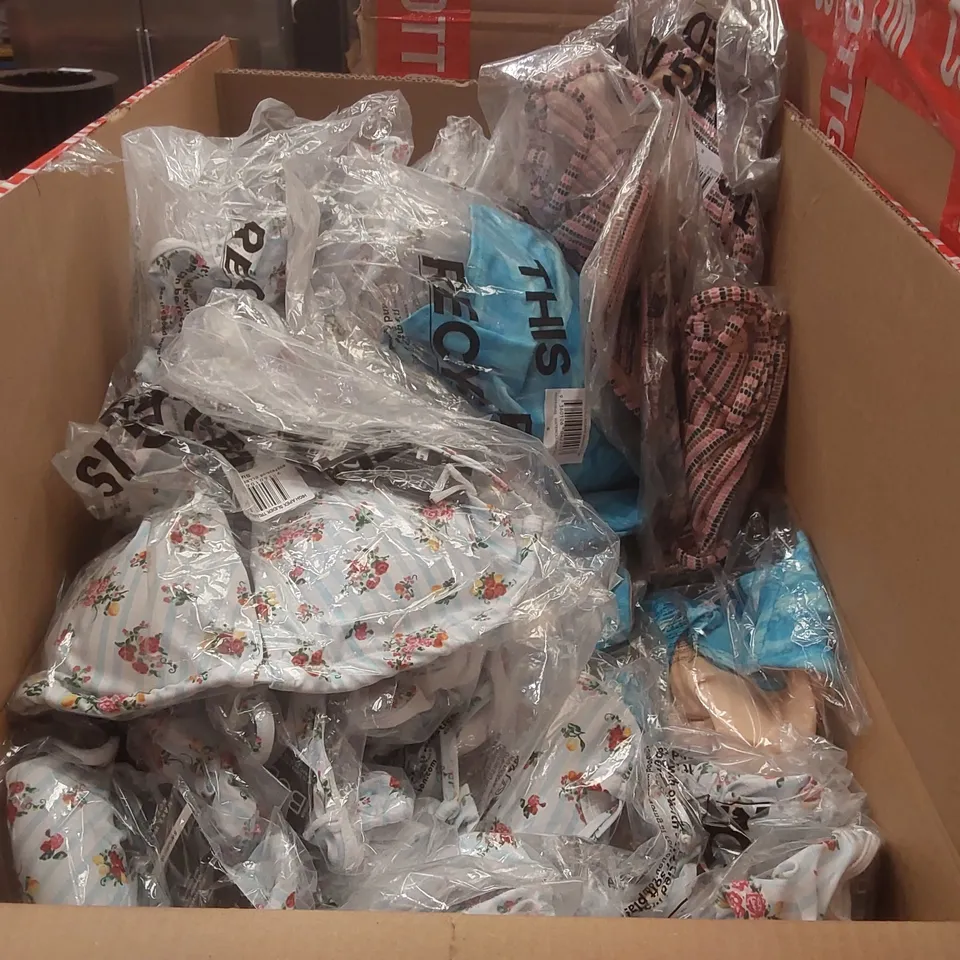 PALLET CONTAINING A VERY LARGE QUANTITY OF BRAND NEW ASSORTED CLOTHING INCLUDING: BIKINIS, JEANS, JUMPERS, BLAZER, SHIRTS, HELLO KITTY HATS ECT AND STORAGE BOX