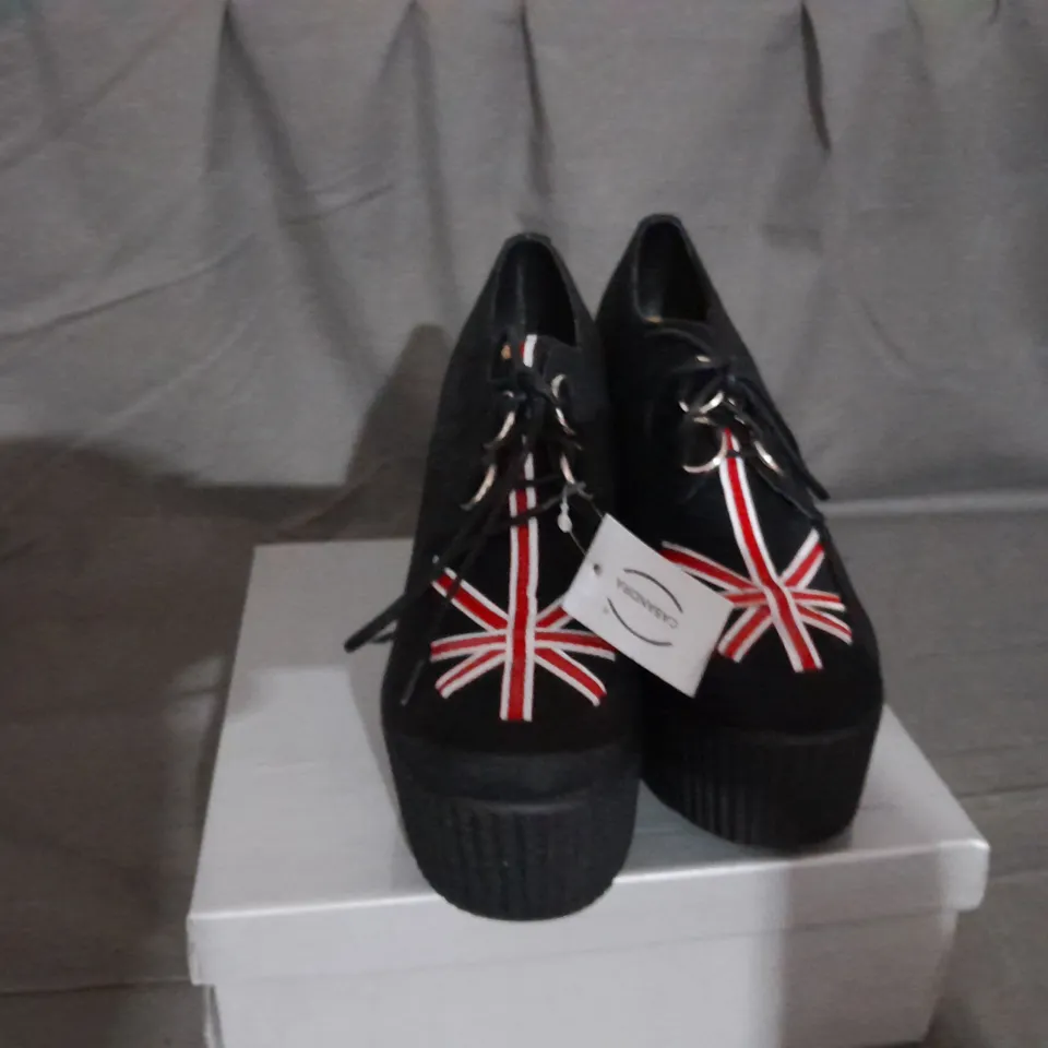 APPROXIMATELY 13 BOXED PAIR OF CASANDRA WEDGE PLATFORM SHOES IN BLACK SUEDE UK FLAG VARIOUS SIZES TO INCLUDE SIZE 6