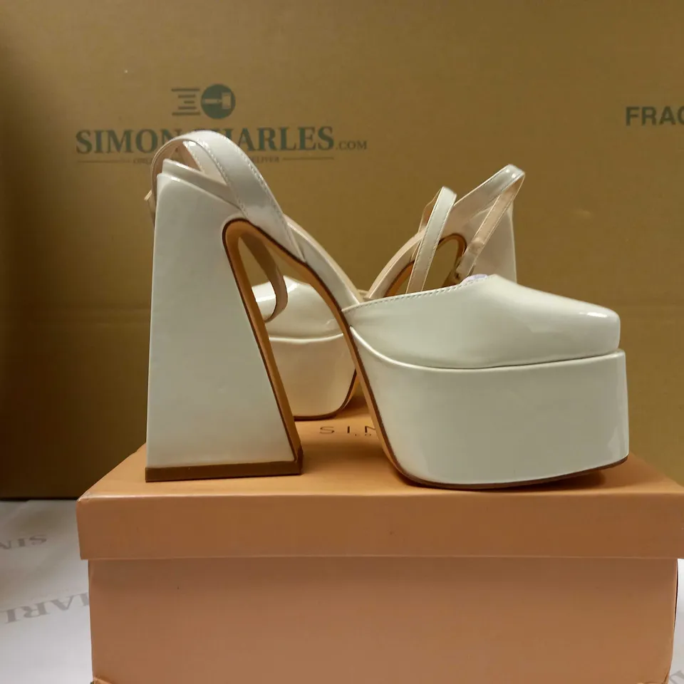 BOXED PAIR OF SIMMI CREAM PLATFORM HEELS - SIZE 4