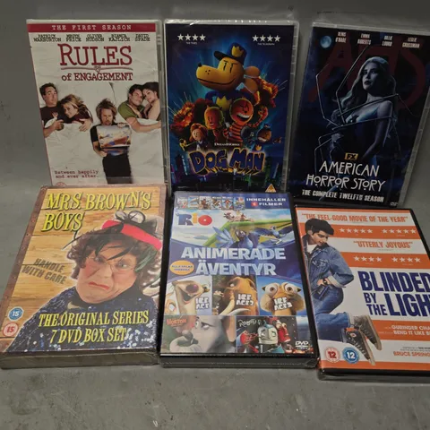 TOTE OF APPROXIMATELY 11 ASSORTED DVD'S TO INCLUDE - DOG MAN , BLINDED BY THE LIGHT , MRS BROWNS BOYS ETC