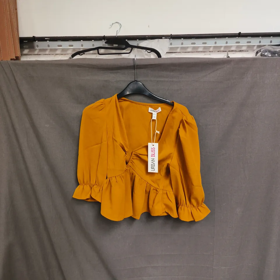 BOX OF APPROXIMATELY 48 URBAN BLISS MUSTARD WRAP BLOUSE WITH RUCHED RUFFLE HEM – WOMEN'S TOP - SIZES 8 /16