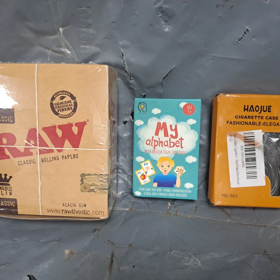 APPROXIMATELY 10 ASSORTED HOUSEHOLD ITEMS TO INCLUDE MY ALPHABET FLASH CARDS, RAW CLASSIC ROLLING PAPERS, ETC