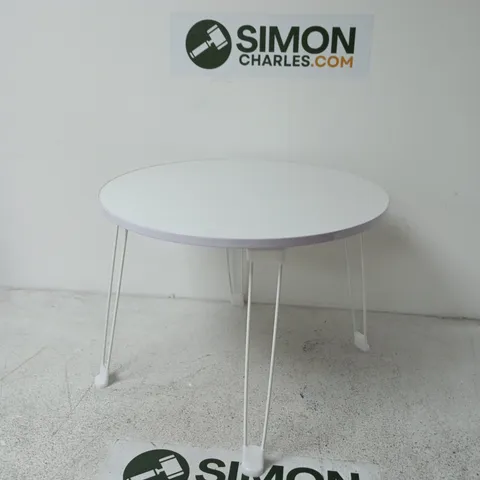 ROUND WHITE COFFEE TABLE WITH SLENDER HAIRPIN LEGS