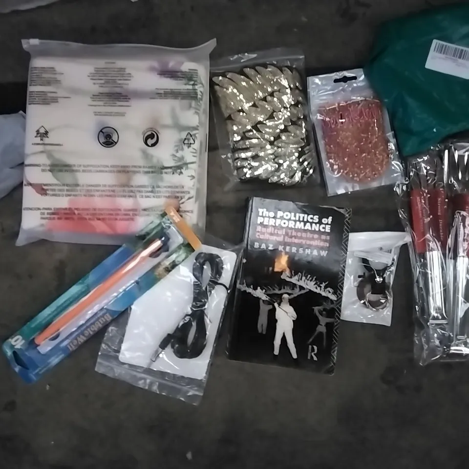 PALLET OF ASSORTED ITEMS INCLUDING THE POLITICS OF PERFORMANCE, BUBBLE WELL, 2022 CASTLE CALENDER, M DESIGN PLASTIC BASKETS, M DESIGN BLACK WIRE BASKET, STAINLESS STEEL TONGS