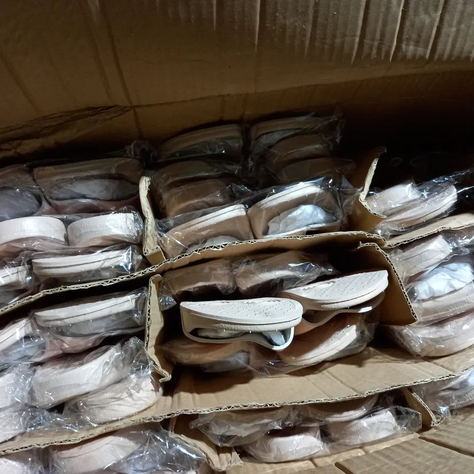 APPROXIMATELY 24 PAIRS OF PINK SLIPPERS IN VARIOUS SIZES TO INCLUDE SIZE 4