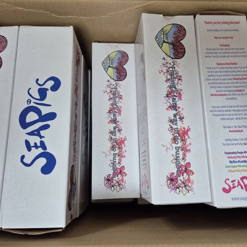 BOX OF APPROXIMATELY 20 SEAPIGS WATER BOTTLES IN PURPLE