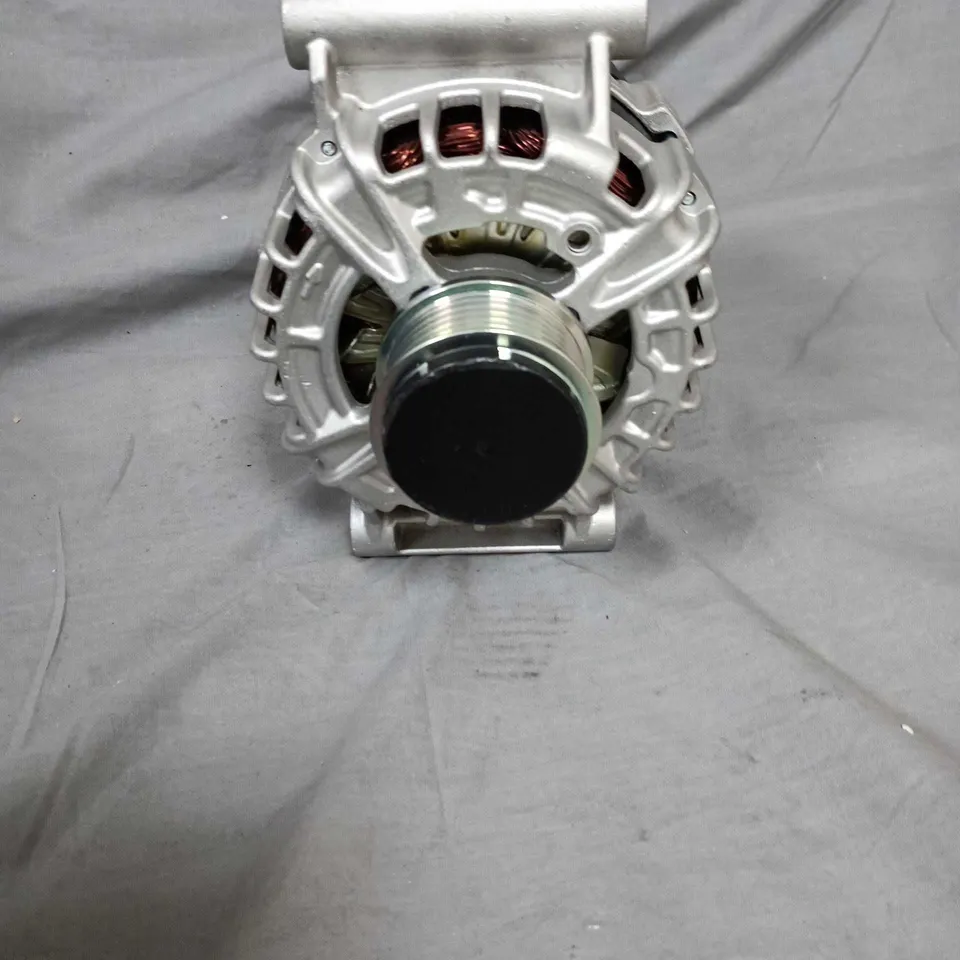 Used automotive alternator with pulley and mounting bracket