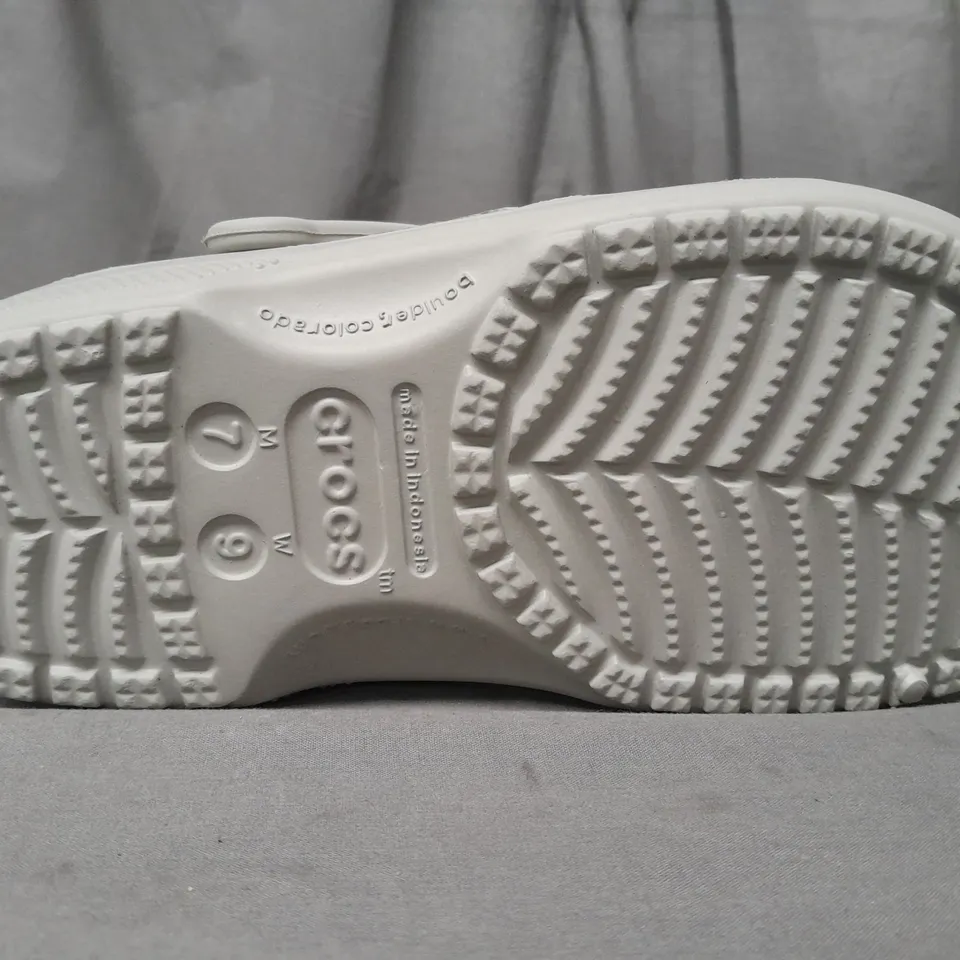 PAIR OF CROCS CLASSICS IN GREY UK SIZE M6/W7