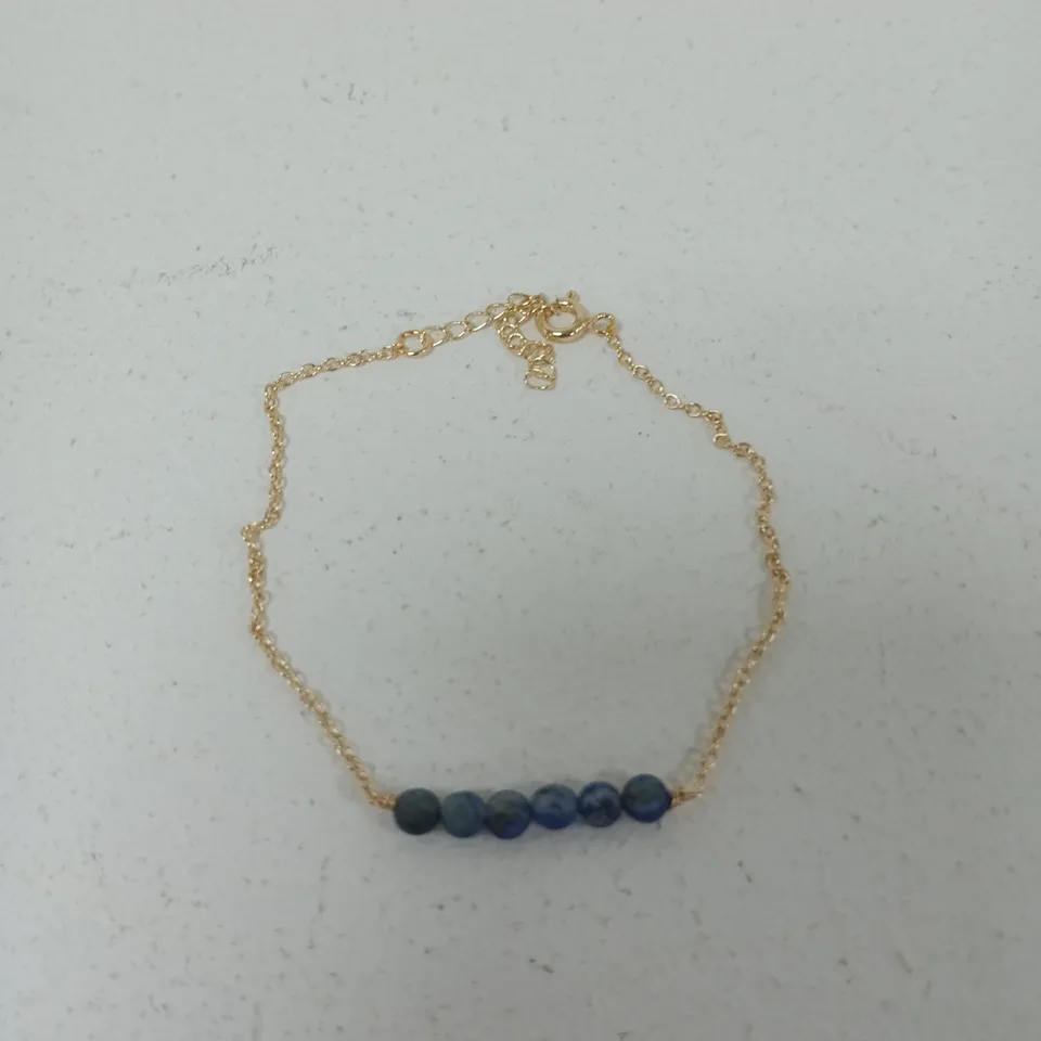 GOLD-TONE BRACELET WITH BLUE BEAD ACCENT