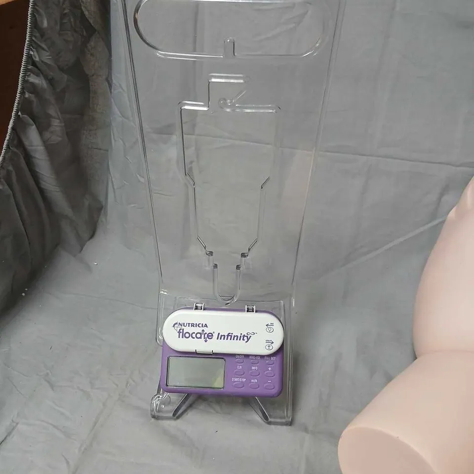 MEDICAL TRAINING BUNDLE: FEMALE TORSO MODEL, NUTRICIA FLOCARE INFINITY FEEDING PUMP, PUSLOM BACKPACK, ASSORTED CONSUMABLES 