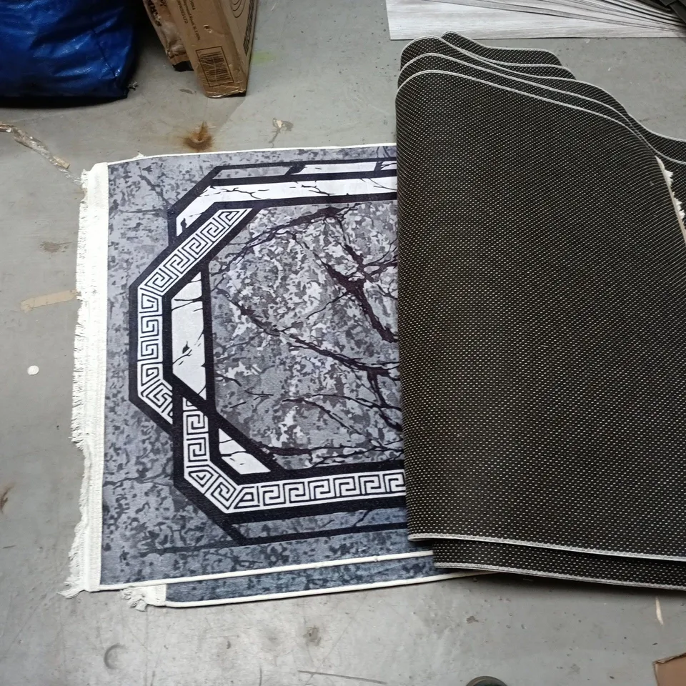 LOT OF 8 RECTANGULAR RUGS IN ASSORTED DESIGNS - SIZE UNSPECIFIED