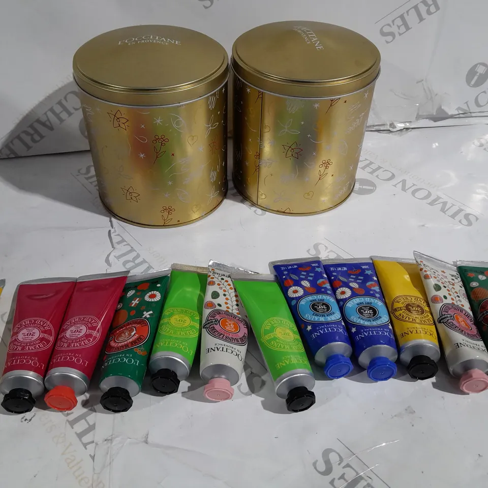 2 X L'OCCITANE TINS FILLED WITH APPROXIMATELY 10 HAND CREAM BOTTLES 