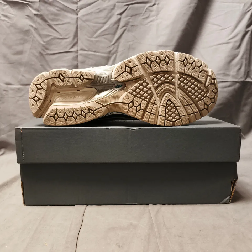 BOXED PAIR OF NEW BALANCE 1906 TRAINERS IN CREAM/SILVER SIZE UK 10