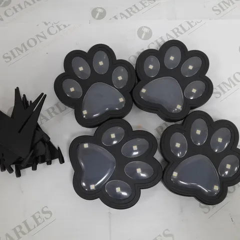 BOXED BELL AND HOWELL SET OF 4 SOLAR PAW LIGHTS