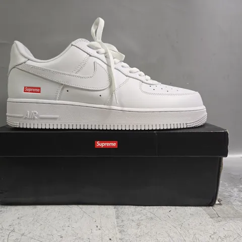 BOXED PAIR OF NIKE AIR FORCE 1 LOW SUPREME SHOES IN WHITE SIZE UK 11