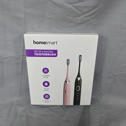 BOXED AND SEALED HOMESMART SET OF 2 ELECTRIC TOOTHBRUSHES – PINK & BLACK