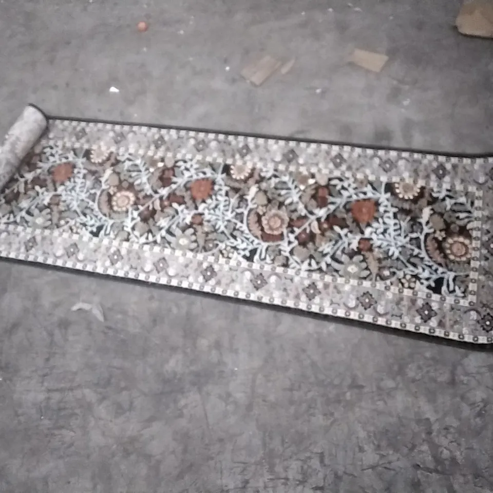 STILLAGE OF APPROXIMATELY 24 DESIGNER RUGS