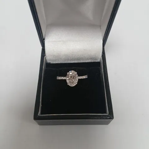 9CT WHITE GOLD RING SET WITH A LAB GROWN OVAL CUT DIAMOND TO CENTRE AND ACCENTS, WEIGHING +2.42CT