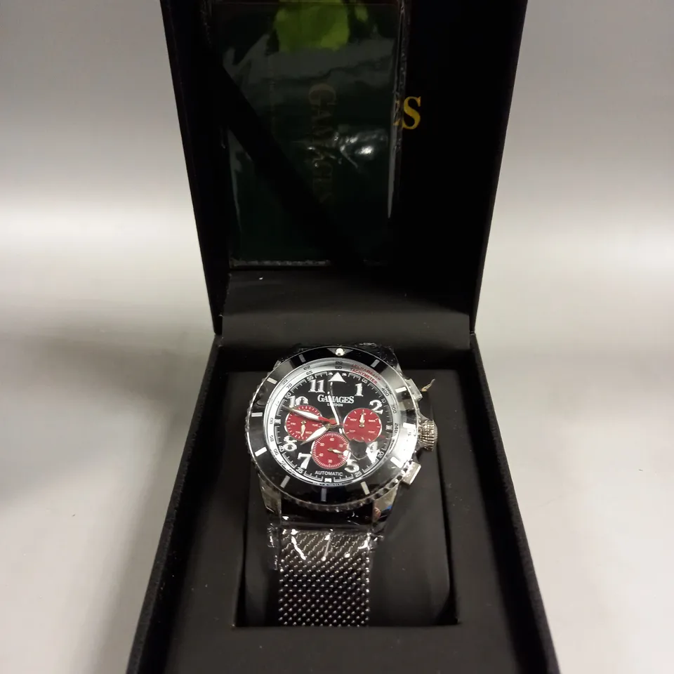 BOXED GAMAGES CONTEMPORARY SPORTS STEEL BLACK DIAL WATCH 