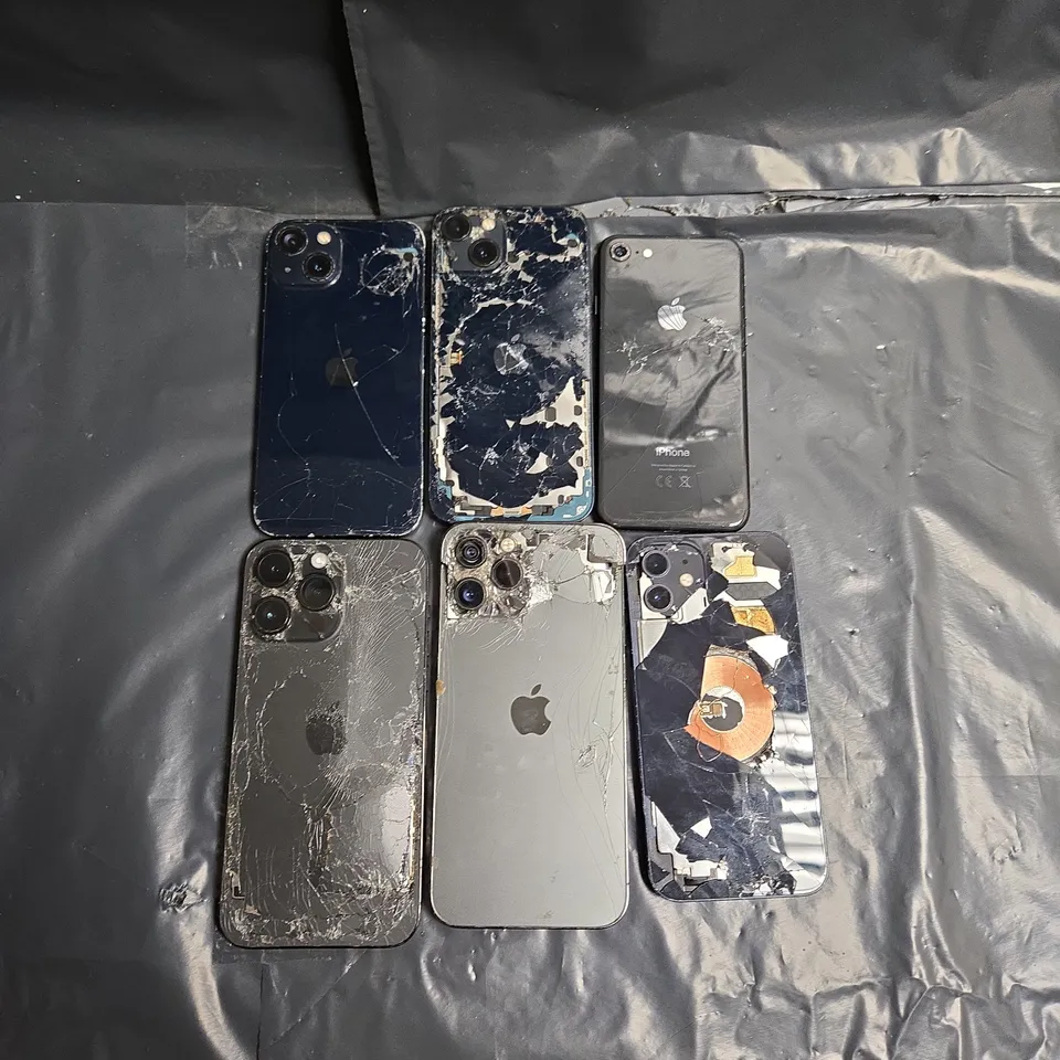 6 ASSORTED SIGNIFICANTLY DAMAGED IPHONES IN VARIOUS STYLES & MODELS