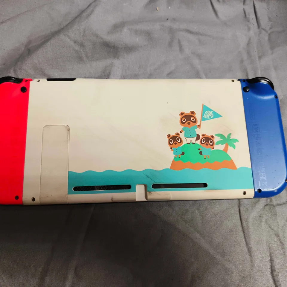 NINTENDO SWITCH CONSOLE WITH BLUE/RED JOY-CONS AND ISLAND ARTWORK SKIN