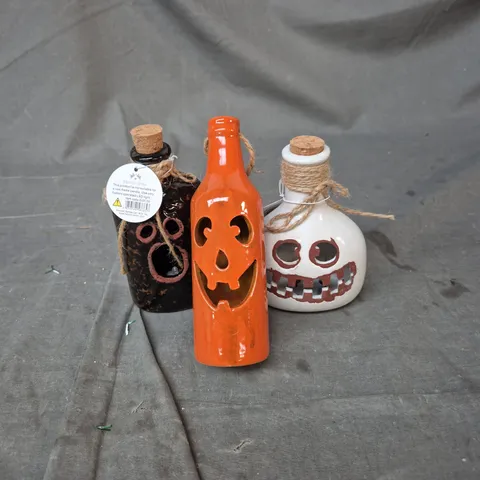 HEAVEN SENDS – SET OF 3 HALLOWEEN JACK-O'-LANTERN DECORATIVE BOTTLES WITH CORK STOPPERS.