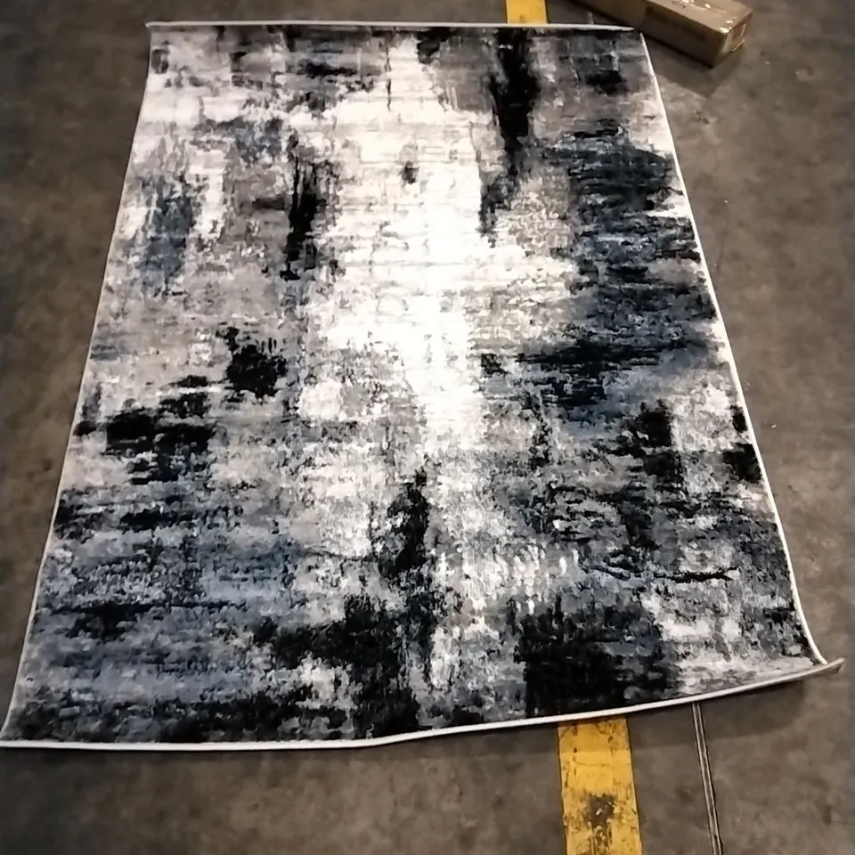 ABSTRACT AREA RUG APPROXIMATELY 120X170CM 
