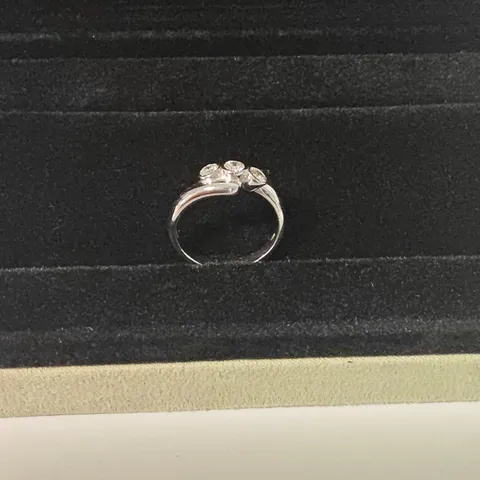18CT WHITE GOLD THREE STONE RING SET WITH A NATURAL DIAMONDS WEIGHING +-0.42CT