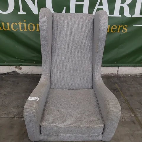 DESIGNER HIGH BACKED WINGED EASY CHAIR WITH STUDDED DETAIL