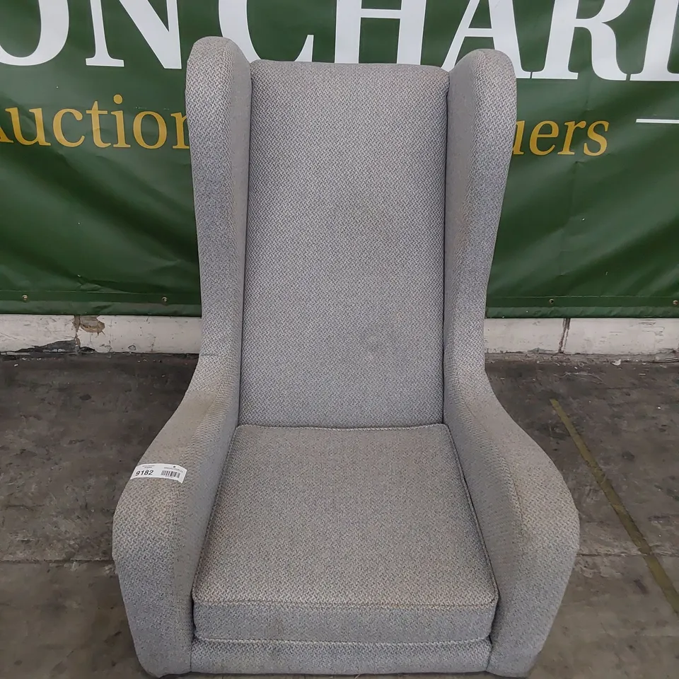 DESIGNER HIGH BACKED WINGED EASY CHAIR WITH STUDDED DETAIL 
