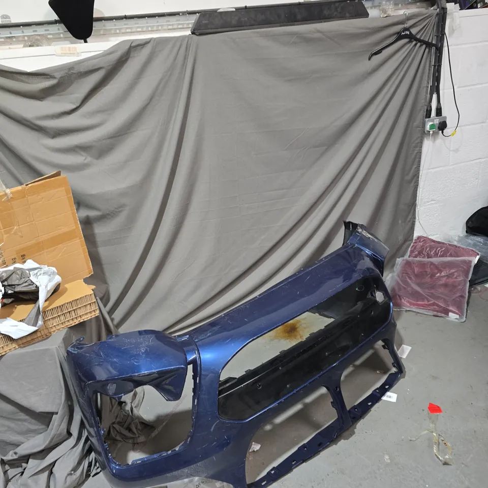 BLUE METALLIC CAR BUMPER COVER .