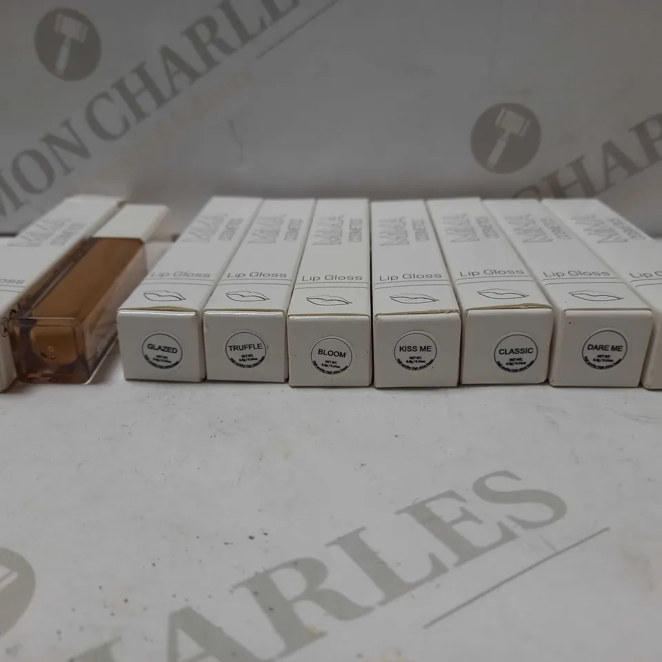 LOT OF APPROX 8 ASSORTED SHADES OF MIMA COSMETICS LIP GLOSS TO INCLUDE STRIPPED, POUT, TRUFFLE, ETC