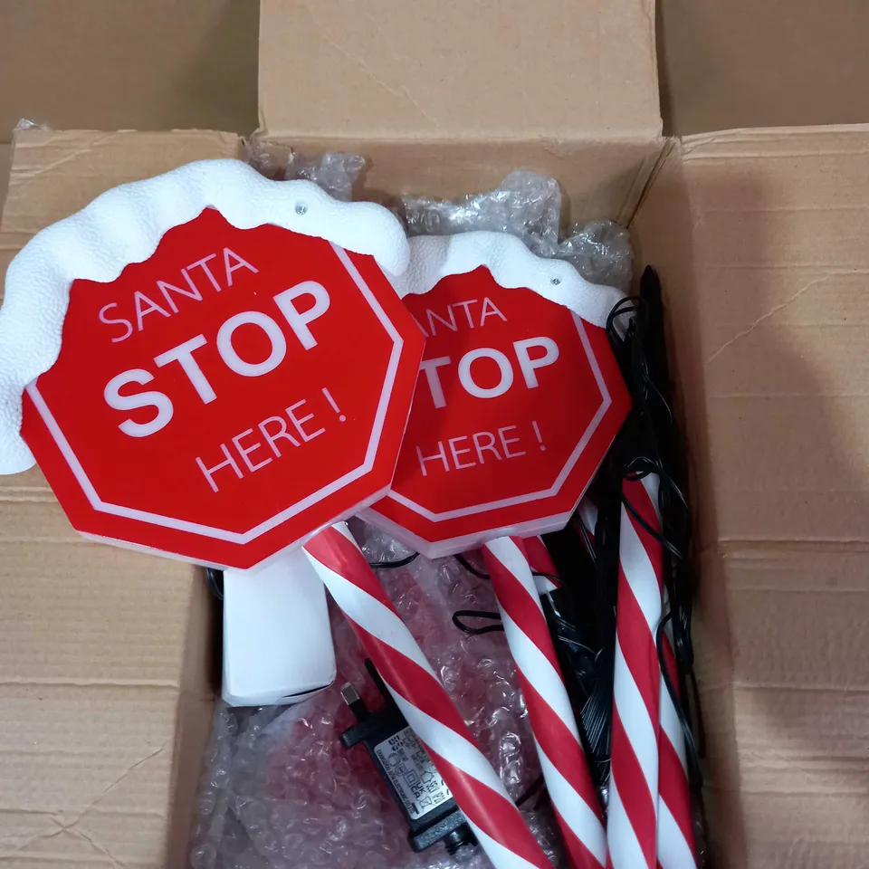 FESTIVE SET OF PRELIT SANTA STOP HERE STAKES