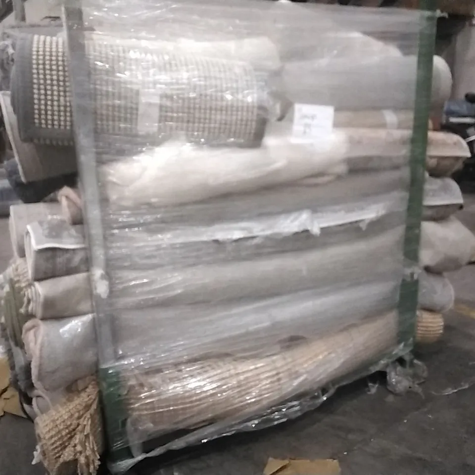 STILLAGE OF APPROXIMATELY 40 ESIGNER RUGS