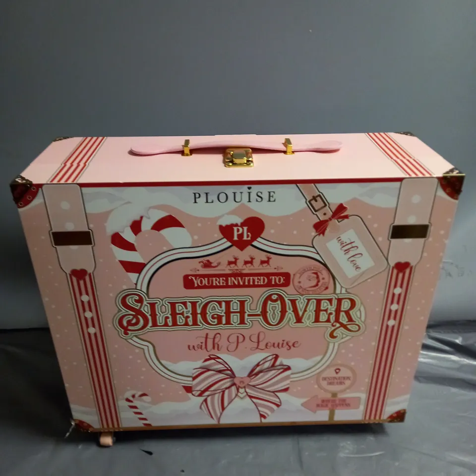 PLOUISE SLEIGH OVER SUITCASE