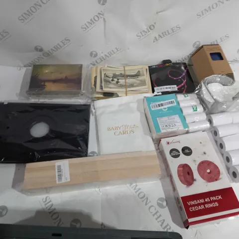 APPROXIMATELY 10 ASSORTED HOUSEHOLD GOODS TO INCLUDE POSTCARDS, LED STRIP LIGHT, AND VINSANI 45 PACK CEDAR RINGS ETC.