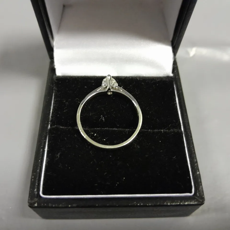 18CT GOLD SOLITAIRE RING SET WITH A NATURAL PEAR CUT DIAMOND WEIGHING