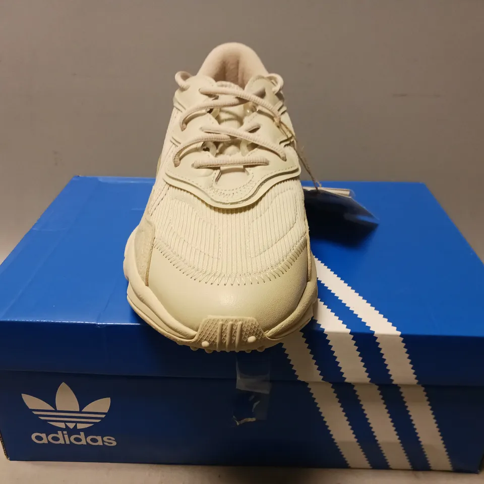BOXED PAIR OF ADIDAS OZWEEGO SHOES IN BEIGE UK SIZE 9