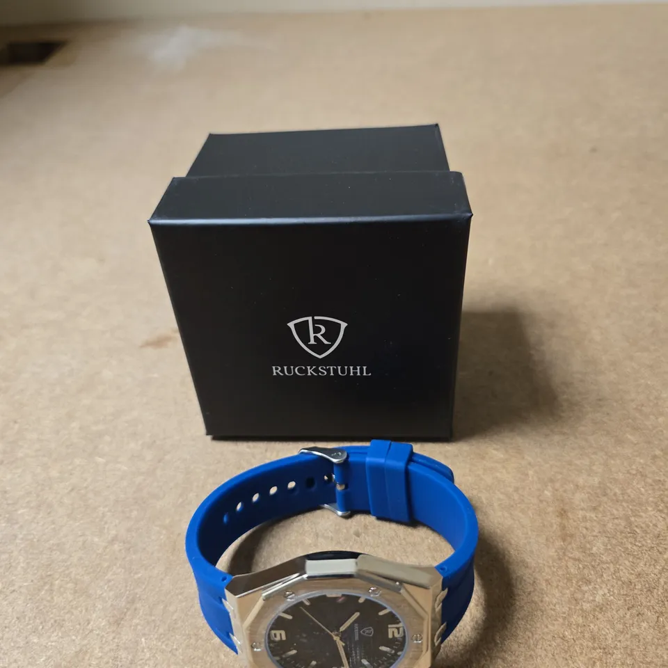 RUCKSTUHL WRISTWATCH WITH TWO TONE DIAL AND  BLUE SILICONE STRAP – BOXED