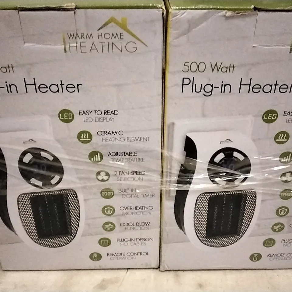 LOT OF 2 WARM HOME CERAMIC PLUG IN HEATERS
