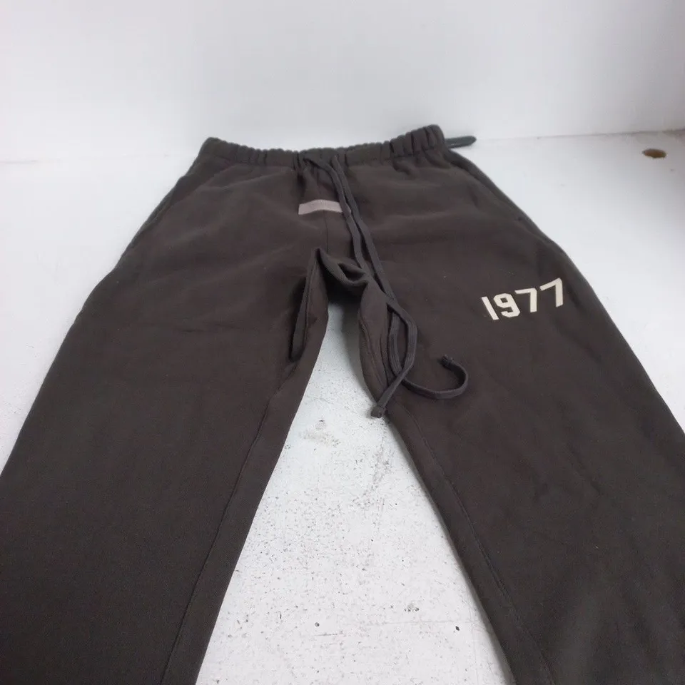 ESSENTIALS BROWN JOGGER TROUSERS, UK S (MEN) – 1977 PRINT